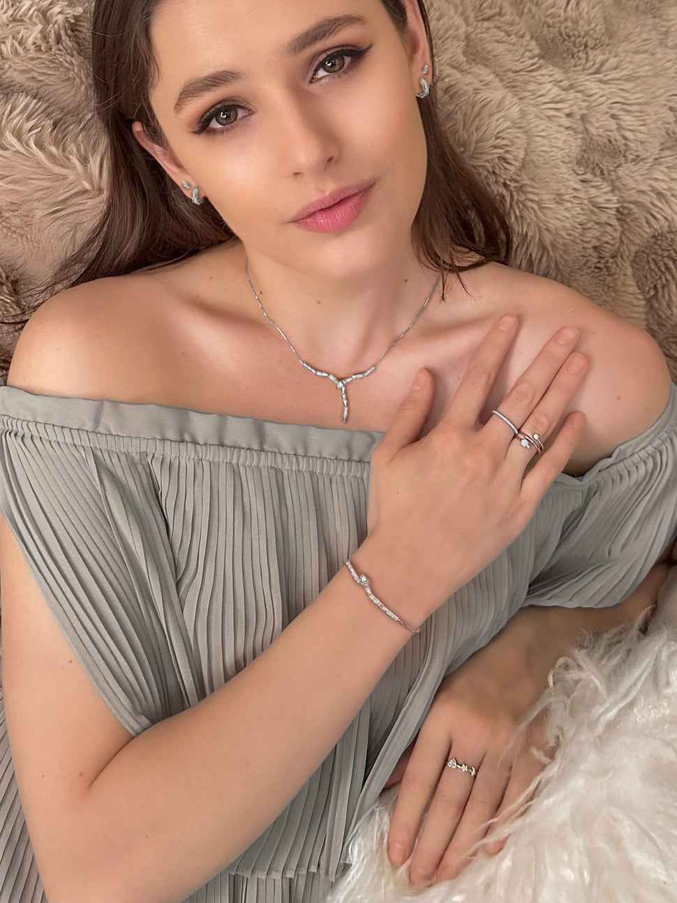 Model wearing Cynthia Rybakoff Fall 2025 Cobra Link Collection in sterling silver rhodium with cubic zirconia