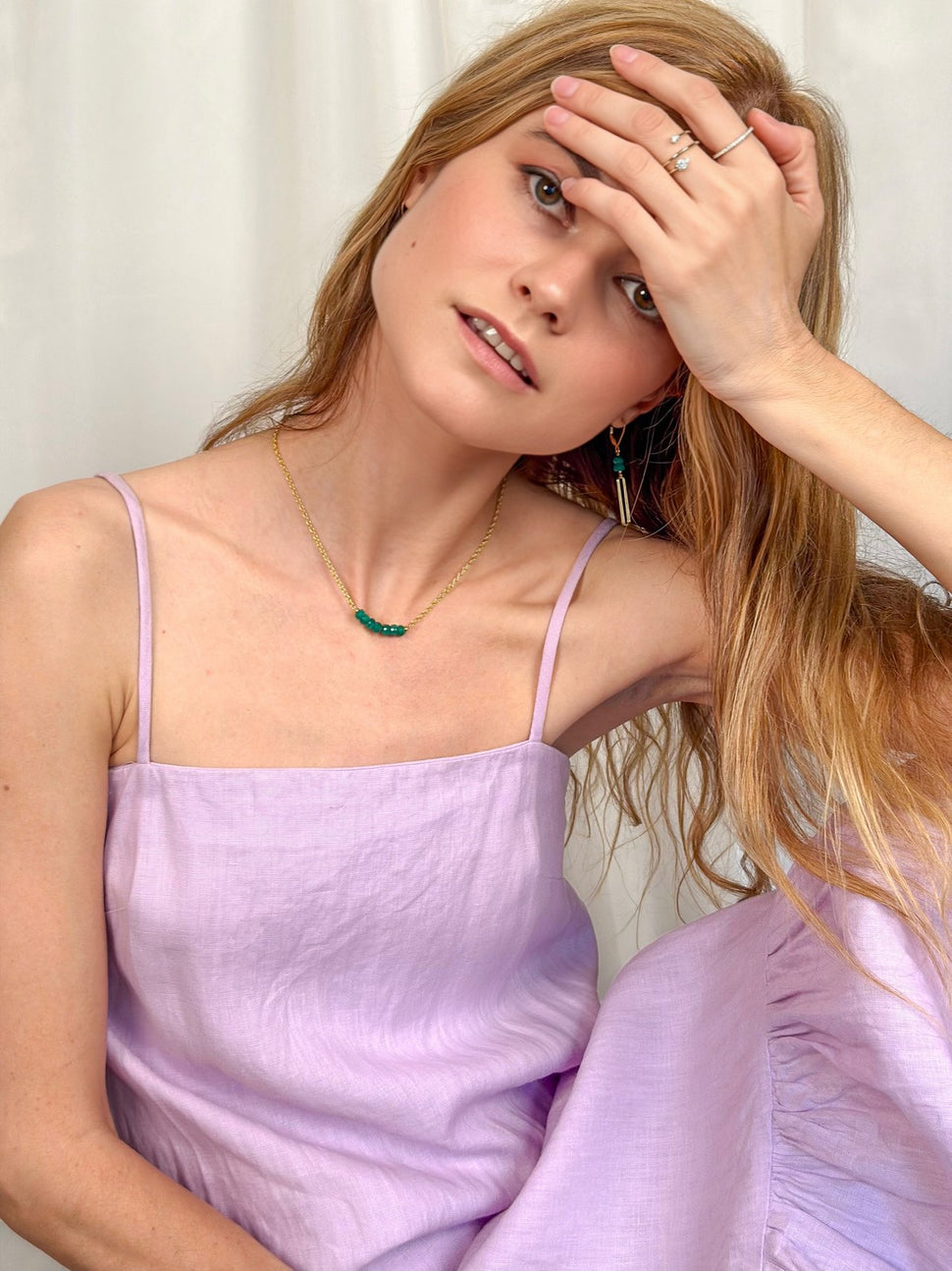 Model wearing our new genuine emerald Linea Earrings and Necklace from our Spring Palette Collection.