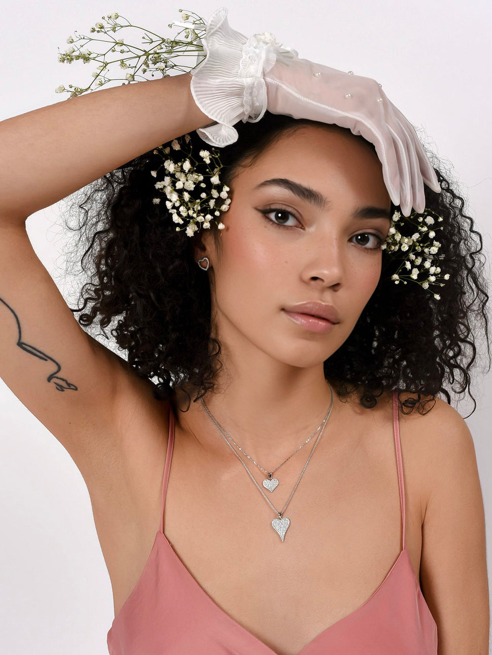 Model wearing Cynthia Rybakoff sparkly Valentine's Day gemstones and sterling silver heart jewelry